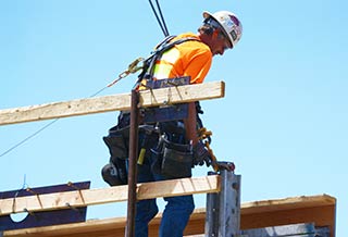 Man Working Up High With Fall Protection