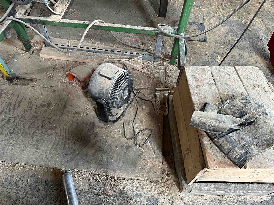 Fox Lumber - space heater on sawdust covered floor