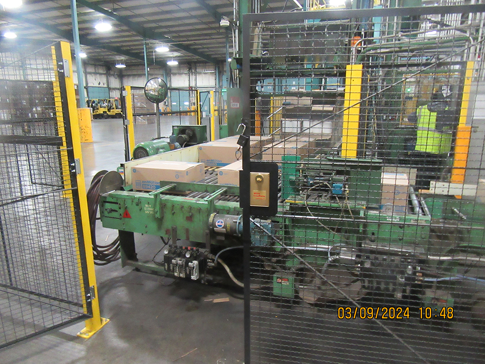 Fence  installed around paper packing machine.