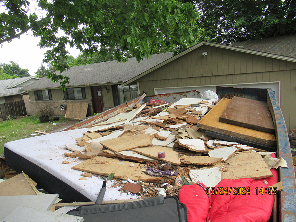 NW Quality Flooring - asbestos in dumpster